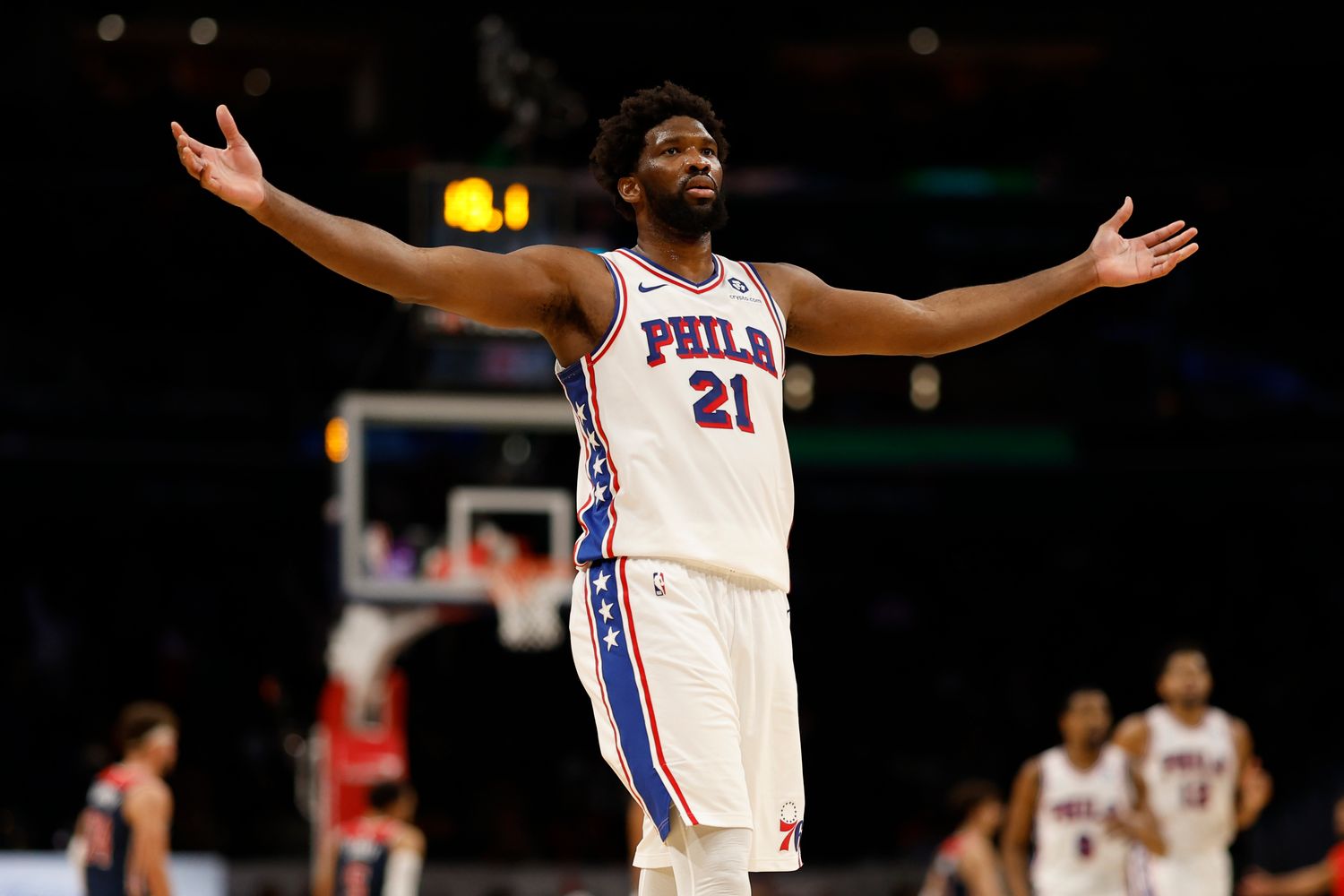Philadelphia 76ers center Joel Embiid (21) celebrates after scoring his 50th point of the game against the Washington Wizards in the fourth quarter at Capital One Arena.
